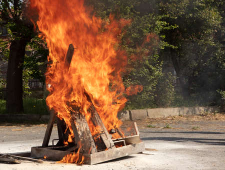 Preparedness for fire drill and training to use a fire extinguisher, detail of fire