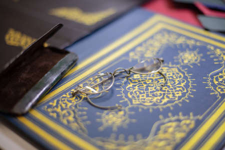 Close up of bespoke book covers and old spectacles at a book binderの写真素材