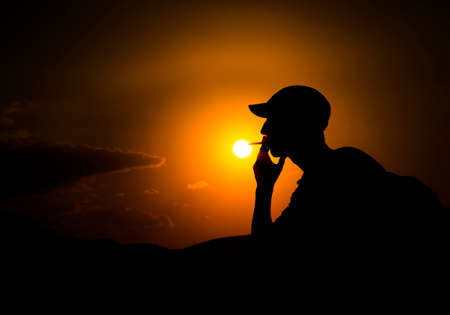 at sunset silhouette in smoke