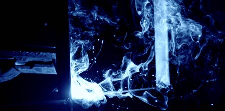 Industrial welder welding fabricated construction in factory, Welding process by Shielded Metal Arc...