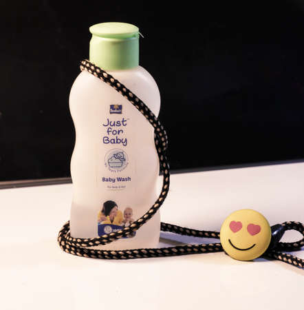 Dhaka,Bangladesh-February 25 ,2020 : Just for baby oil for baby health care daily.Object on a white background with a love emoji.のeditorial素材