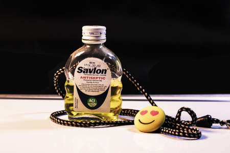 Dhaka-Bangladesh-March 25,2020: Savlon pot with happy emoji smile.Concept for medical.のeditorial素材