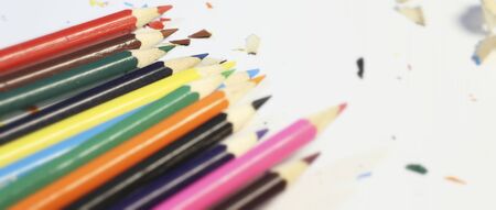 Wooden pencil shavings and colorful crumbs of graphite from sharpener. Art, inspiration, creativity concept. Selective focus.の写真素材
