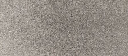 Bright fine-grained sandy texture, natural structure.Facing stone texture.sand fine crumb brown tone texture background.の写真素材