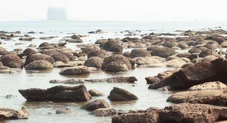 Heap of coral rock and sea beach water at Saint Martin Island.