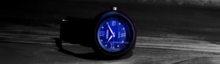 Hand watch neon light effect circle black analog adidas brand watch with wooden background .のeditorial素材