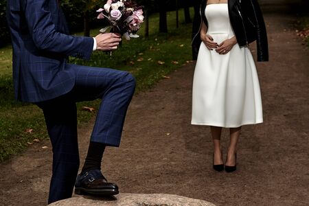 a man gives a woman flowersの写真素材