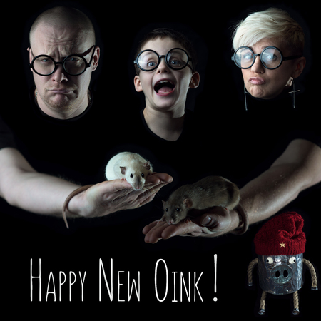 three people with glasses, two rats and a pig