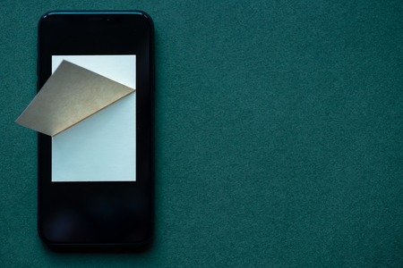 notebook for records in the phone to save information in memory, on a colored backgroundの写真素材