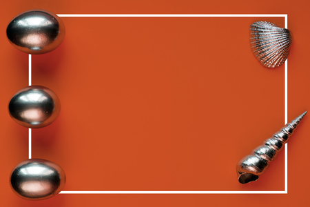 silver eggs and shells on colored backgroundの写真素材