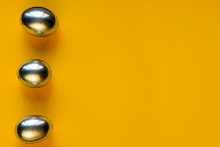 silver eggs and shells on bright colored backgroundの写真素材