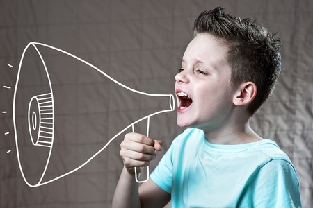 a boy painted with a loudspeaker shouting at him