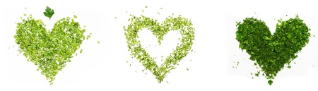 green heart of chopped parsley and dill on white backgroundの写真素材