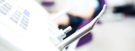 Blurred dental office. Tools are in the foreground.の写真素材