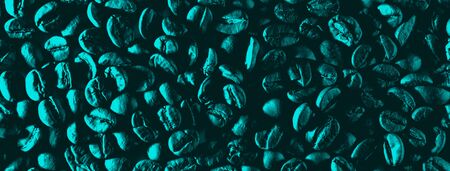 a scattering of coffee beans for the background illuminated with colored neon