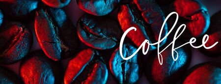 a scattering of coffee beans for the background illuminated with colored neonの写真素材