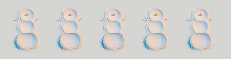 New Year's concept, a snowman made of flour with a carrot nom and hands matches, in neon light. Banner, patternの写真素材