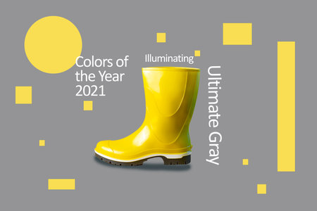 Bright yellow rubber boot against the same color. A minimalist concept on the theme of color 2021の写真素材