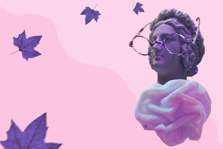Sculpture of an antique head of purple color in glasses and lush clothes on a pink background for an optics or vision store.の写真素材