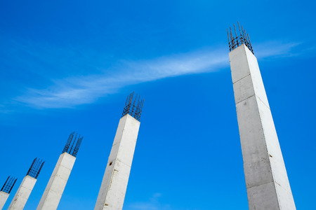 concrete column structure in construction site and blue sky backgroundの写真素材