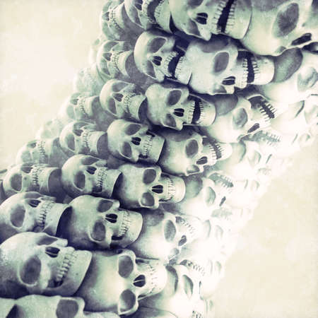 3d rendering digital illustration a pillar of skulls in cartoon style on old scratched surface with depth of field effect. Modern grunge background. Urban abstract artworkの写真素材