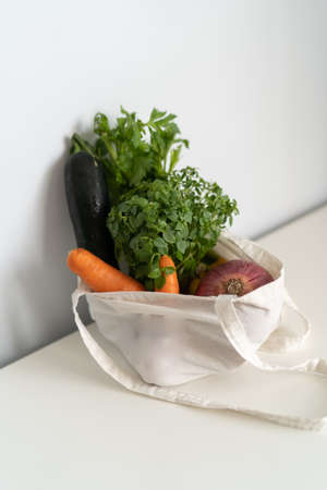 Fresh vegetables in bag set on light surface , healthy lifestyle concept