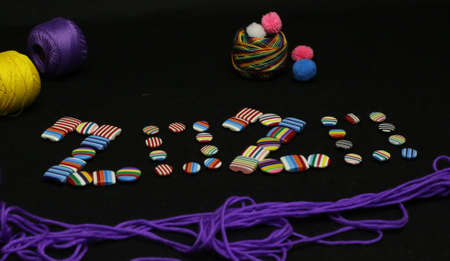 Happy new year 2020 clothing brand colorful buttons Photography. Merry Christmas 2020 sale on tailor shop.の写真素材