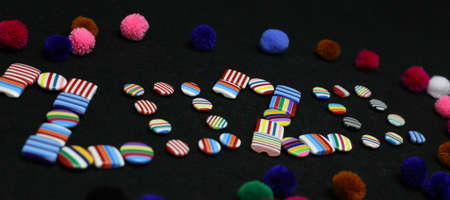 Happy new year 2020 clothing brand colorful buttons Photography. Merry Christmas 2020 sale on tailor shop.の写真素材