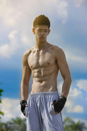 Muscular Asian Model Posing AResjjの写真素材