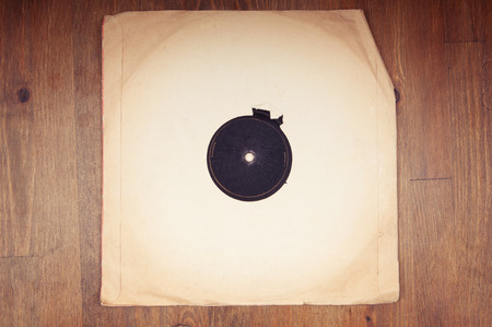 Old vinyl record in paper envelope closeupの写真素材
