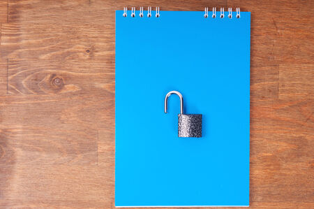 Blue notebook with lock, concept of data securityの写真素材