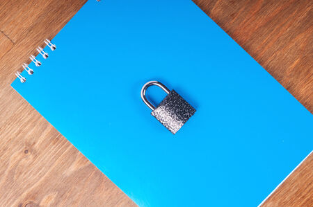 Blue notebook with lock, concept of data securityの写真素材