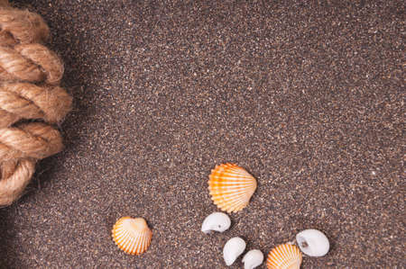 Marine rope with a knot on the sandの写真素材