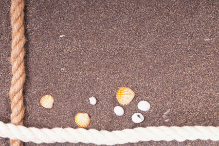 Marine rope with a knot on the sandの写真素材