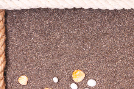 Marine rope with a knot on the sandの写真素材