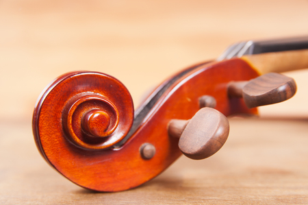 
Violin and bow on a wooden tableの写真素材