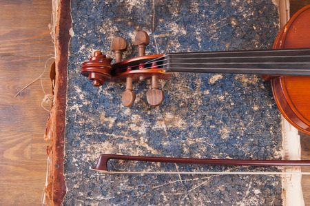 Violin, bow and old book tableの写真素材