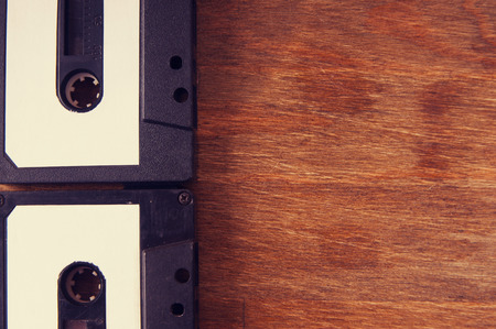 Audio cassette on a wooden tableの写真素材