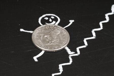 financial growth concept - cheerful coin runs up the stairs , drawing with chalkの写真素材
