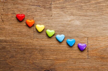 Bright hearts on wooden backgroundの写真素材