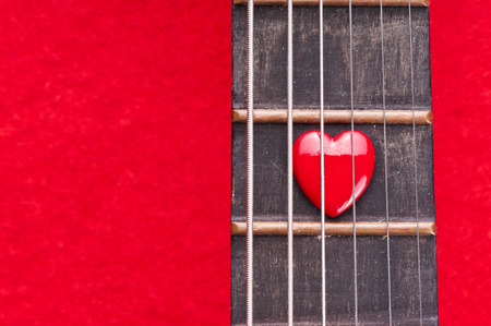 Valentines Day background with hearts on vintage guitarの写真素材