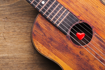 Valentines Day background with hearts on vintage guitarの写真素材