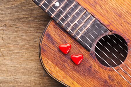 Valentines Day background with hearts on vintage guitarの写真素材