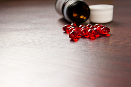 red drugs and pills on the table