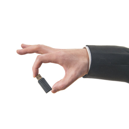 Flash drive in hand isolated on white backgroundの写真素材