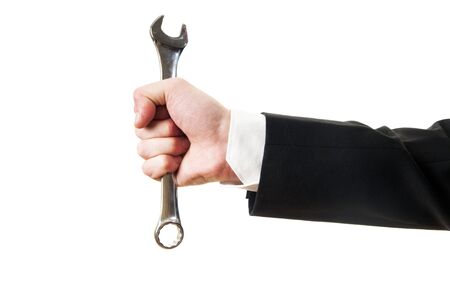 Businessman hand hold spanner tool in hand isolated on whiteの写真素材