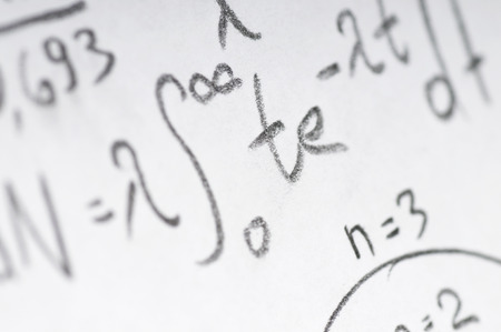 sheet of paper filled with calculations of nuclear and quantum physics as a backgroundの写真素材