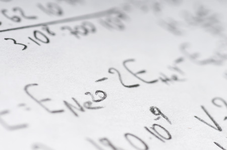sheet of paper filled with calculations of nuclear and quantum physics as a backgroundの写真素材