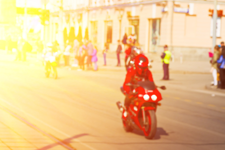 Blurred background with a motorcyclist in a city on the moveの写真素材
