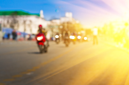 Blurred background with a motorcyclist in a city on the moveの写真素材